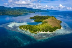 Halmahera Island View From Above With Small Hut In Shore