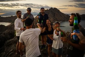 friends-enjoying-Bintang-beers-on-top-of-Padar-Island-in-Komodo