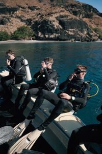Three Diver Preparing To Dive Scaled