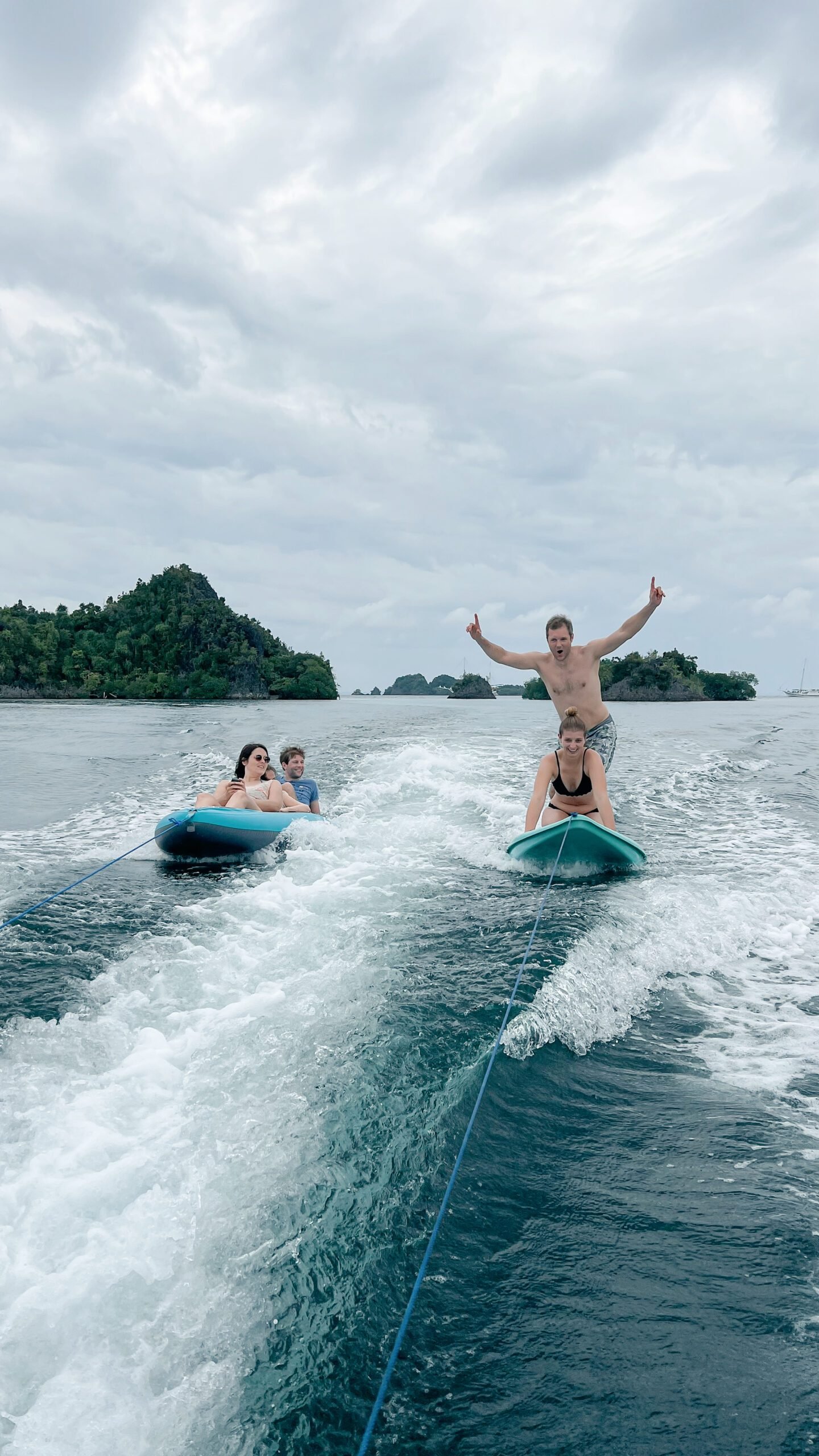 Guests kayaking and paddle boarding in Raja Ampat